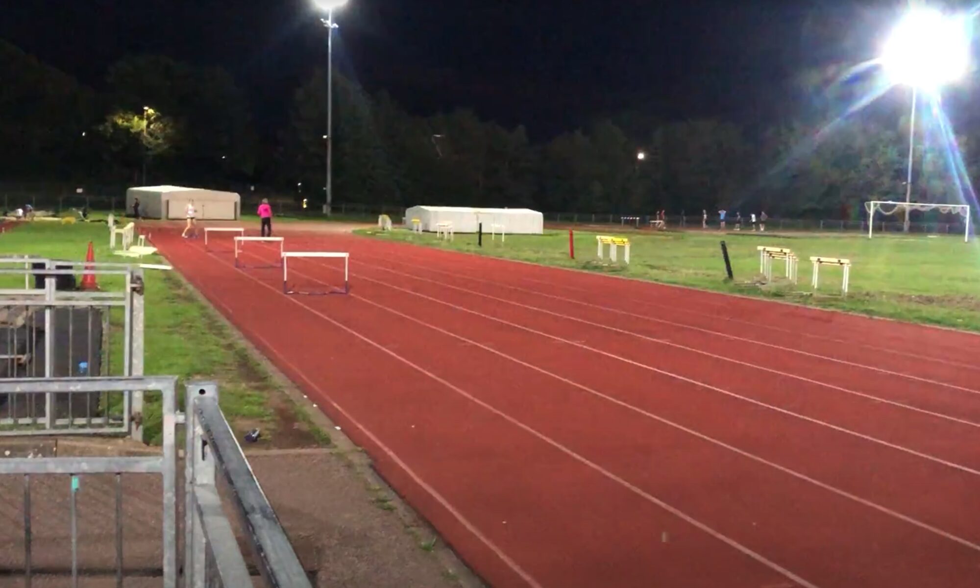 athletes on track at nigh