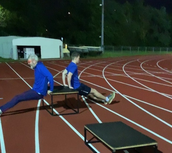 Athletes doing arm dips